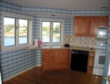 kitchen with old blue checkered wallpaper